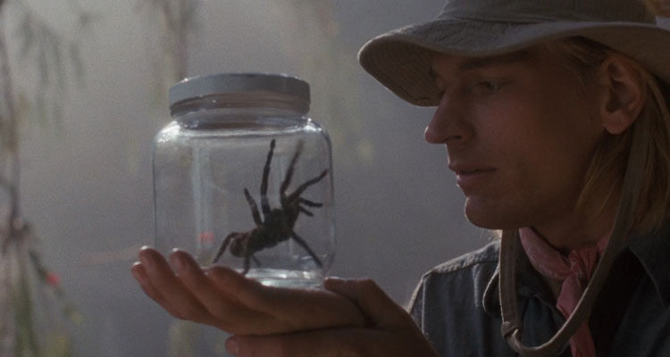 Arachnophobia 1990 Movie Scene Julian Sands as Dr. James Atherton holding a spider trapped inside a jar