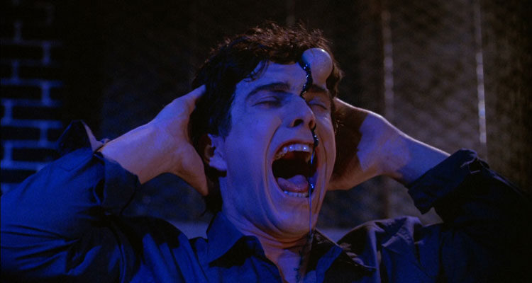 Brain Damage 1988 Movie Scene Rick Hearst as Brian holding his head as a growing bump appears on his forehead