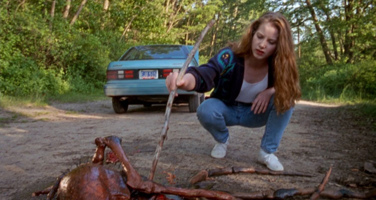 Mosquito 1995 Movie Scene Rachel Loiselle as Megan poking a dead giant mosquito with a stick
