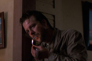 Angel Heart 1987 Movie Scene Mickey Rourke as Harry Angel lighting a cigarette with a match