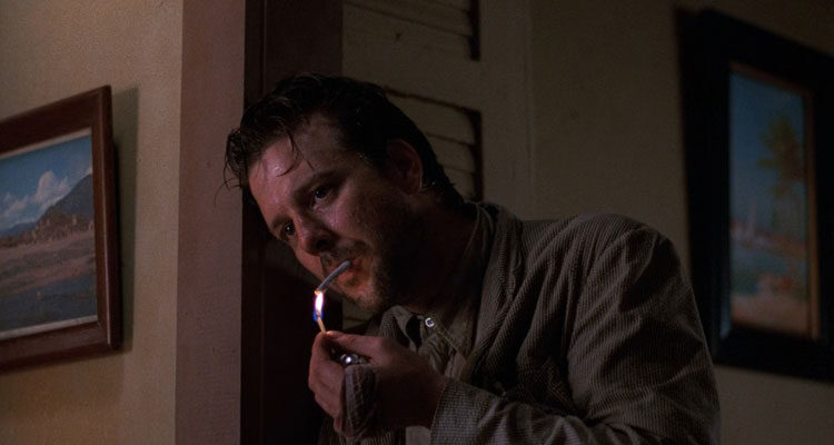 Angel Heart 1987 Movie Scene Mickey Rourke as Harry Angel lighting a cigarette with a match