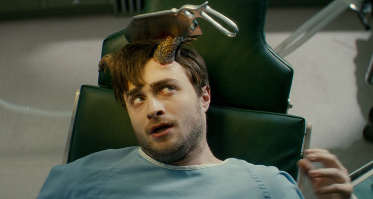 Horns 2013 Movie Scene Daniel Radcliffe as Ig Perrish in a doctors office with a saw stuck in his horn