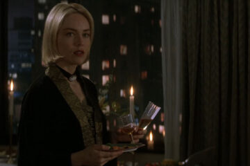 Sliver 1993 Movie Scene Sharon Stone as Carly Norris holding wine glasses at a party