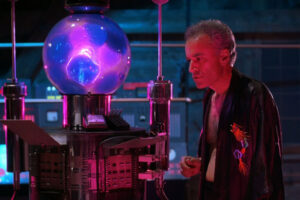 From Beyond 1986 Movie Scene Ted Sorel as Dr. Edward Pretorius nest to The Resonator as it's working