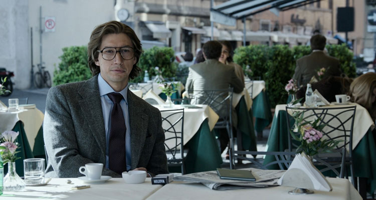 House of Gucci 2021 Movie Scene Adam Driver as Maurizio Gucci drinking espresso and smoking in a coffee shop