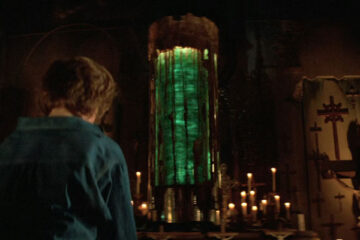 Prince of Darkness 1987 Movie Scene One of the students praying to the large cylinder with green liquid swirling inside of it