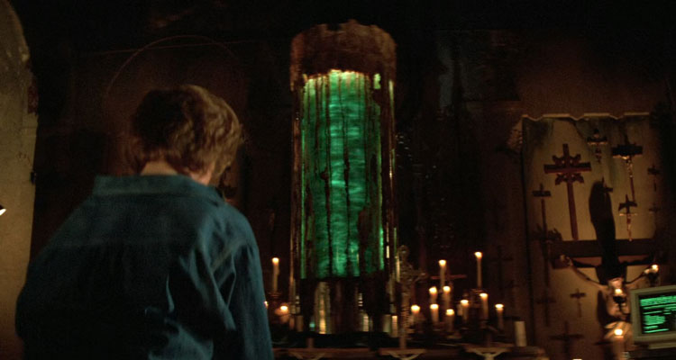 Prince of Darkness 1987 Movie Scene One of the students praying to the large cylinder with green liquid swirling inside of it