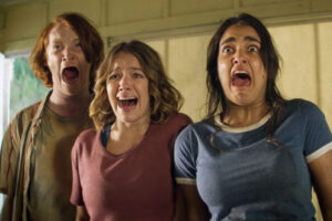 The Package 2018 Movie Scene Geraldine Viswanathan as Becky, Sadie Calvano as Sarah and Luke Spencer Roberts as Donnie screaming upon seeing Daniel Doheny as Sean doing something