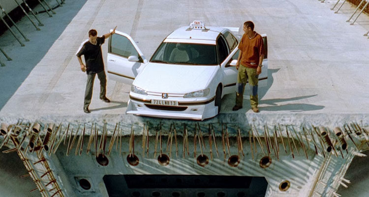 Taxi 1998 Movie Scene Samy Naceri as Daniel and Frederic Diefenthal as Emilien standing at the edge of unfinished bridge next to their car