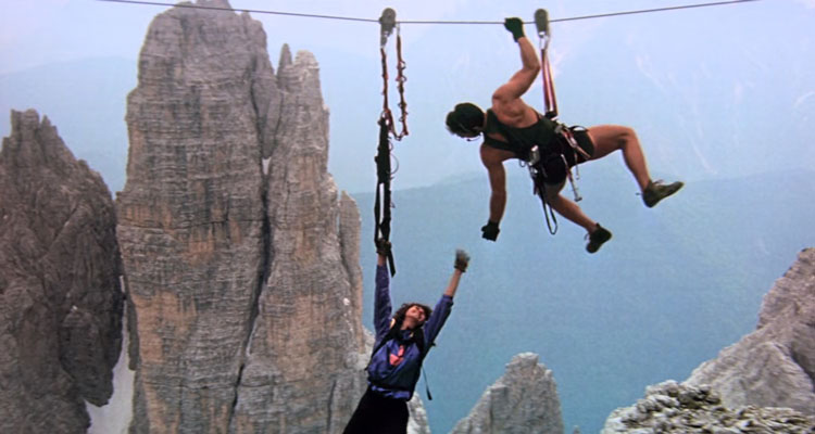 Cliffhanger 1993 Movie Scene Sylvester Stallone as Gabe Walker extending his hand to woman hanging on to her life
