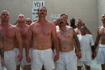 Felon 2008 Movie Scene Prisoners with tattoos and wearing white underwear standing in the yard