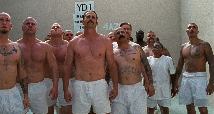 Felon 2008 Movie Scene Prisoners with tattoos and wearing white underwear standing in the yard