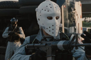 Heat 1995 Movie Scene Val Kilmer as Chris wearing a mask and holding a gun during the robbery of an armored truck