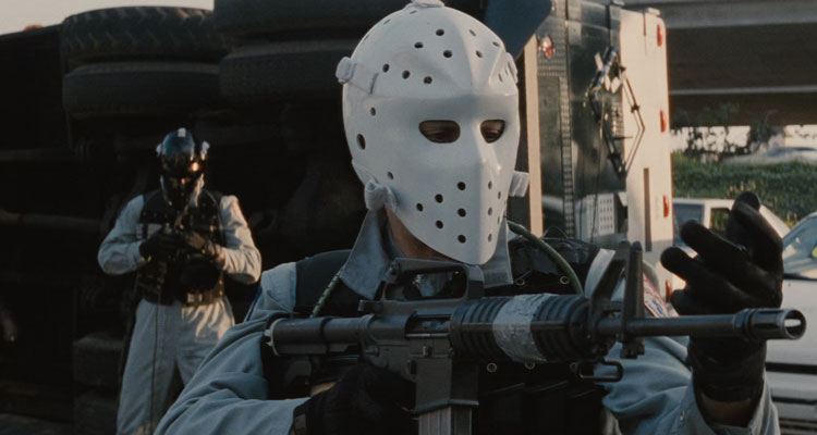 Heat 1995 Movie Scene Val Kilmer as Chris wearing a mask and holding a gun during the robbery of an armored truck