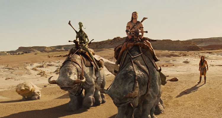 John Carter 2012 Movie Scene Taylor Kitsch as John Carter riding a strange creature on Mars