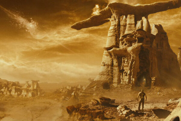 Riddick 2013 Movie Scene Riddick walking on a desolate and sun-drenched strange planet