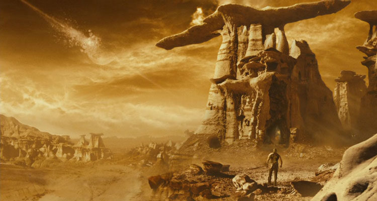 Riddick 2013 Movie Scene Riddick walking on a desolate and sun-drenched strange planet