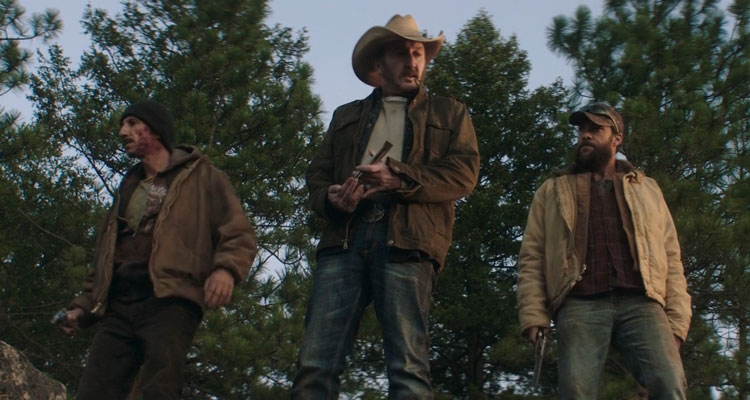 The Last Victim 2021 Movie Scene Ralph Ineson as Jake emptying his revolver with Kyle Schmid as Bull and Paul Belsito as Snoopy standing next to him