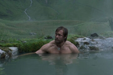 The Northman 2022 Movie Scene Alexander Skarsgård as Amleth taking a bath