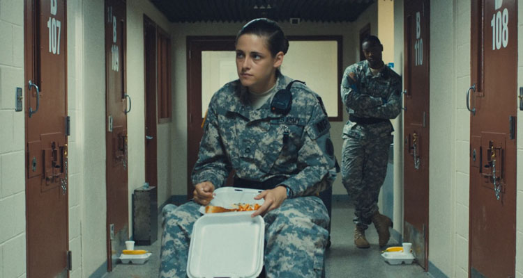 Camp X Ray 2014 Movie Scene Kristen Stewart as Cole in a uniform sitting on a lunch trolley and eating