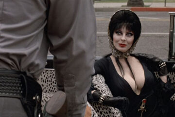 Elvira Mistress of the Dark 1988 Movie Scene Cassandra Peterson as Elvira in her car after being stopped by police