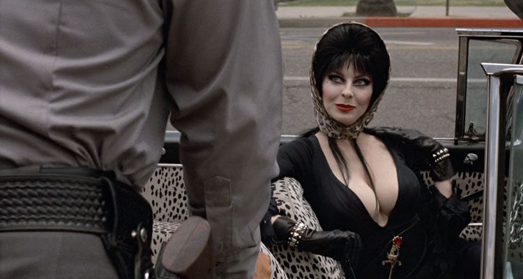 Elvira Mistress of the Dark 1988 Movie Scene Cassandra Peterson as Elvira in her car after being stopped by police