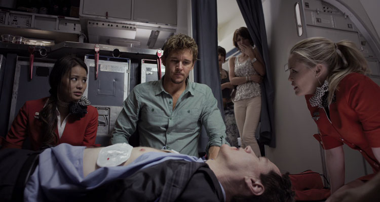 Flight 7500 2014 Movie Scene Ryan Kwanten as Brad trying to revive a passenger onboard a plane