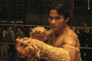 Ong Bak 2003 Movie Scene Tony Jaa as Ting with his hands wrapped in rope up to his elbows, a trademark of Muay Korat