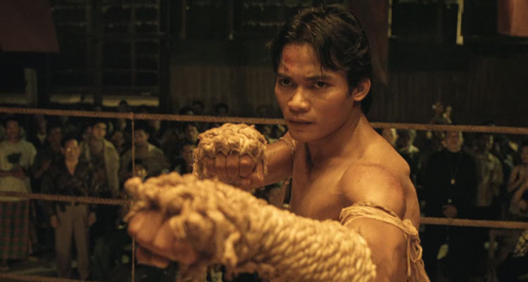 Ong Bak 2003 Movie Scene Tony Jaa as Ting with his hands wrapped in rope up to his elbows, a trademark of Muay Korat