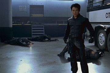 The One 2001 Movie Scene Jet Li as Gabriel Yulaw standing in the garage of the police station after he beat up the police officers