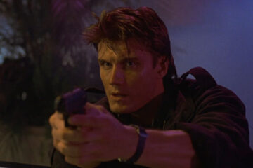 Dark Angel 1990 Movie Scene Dolph Lundgren as Det. Jack Caine holding a gun