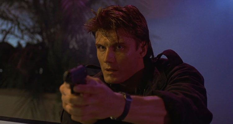 Dark Angel 1990 Movie Scene Dolph Lundgren as Det. Jack Caine holding a gun