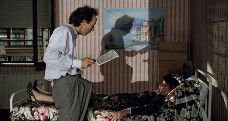 Il Mostro AKA The Monster 1994 Movie Scene Roberto Benigni as Loris holding a meatcleaver with an erection frightening Dominique Lavanant as Yolanda