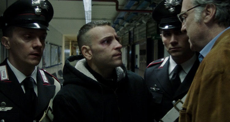 Sulla Mia Pelle AKA On My Skin 2018 Movie Scene Alessandro Borghi as Stefano Cucchi meeting his father played by Massimiliano Tortora while escorted by the police