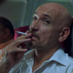 Sexy Beast Movie 2000 Scene Ben Kingsley as Don Logan smoking a cigarette aboard a plane