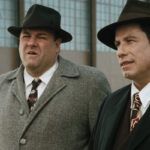 Lonely Hearts Movie 2006 Scene John Travolta as Elmer Robinson and James Gandolfini as Det. Charles Hilderbrandt talking to other police officers about the case