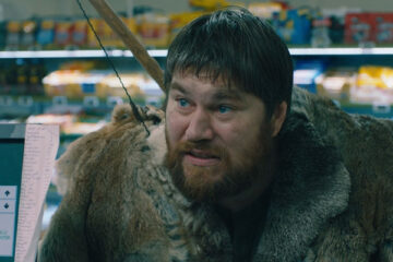 Wild Men Movie 2021 Scene Rasmus Bjerg as Martin in the supermarket dressed in fur