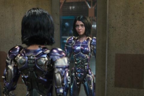 Alita Battle Angel 2019 Movie Scene Rosa Salazar as Alita wearing her purple armor and sword