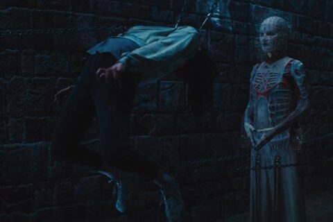 Hellraiser 2022 Movie Scene Jamie Clayton as Pinhead or Hell Priest torturing her victim with chains