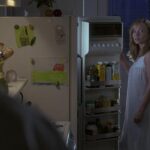 The Hand that Rocks the Cradle 1992 Movie Scene Rebecca De Mornay as Peyton wearing only her nightgown and standing next to a fridge