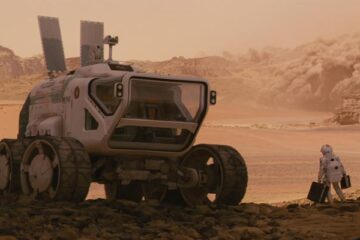 The Last Days On Mars 2013 Movie Scene An astronaut standing next to a huge Mars rover with the storm approaching on the horizon