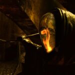 Vidocq 2001 Movie Scene The Alchemist wearing a golden reflective mask and a black cape