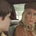 Life of Crime 2013 Movie Scene Jennifer Aniston as Mickey Dawson in a car wearing a beret