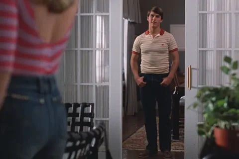 Risky Business 1983 Movie Scene Tom Cruise as Joel looking at Rebecca De Mornay as Lana in tight jeans