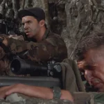 Sniper 1993 Movie Scene Tom Berenger as Thomas Beckett looking through the scope of his M40 sniper rifle and Billy Zane as Richard Miller doing the same