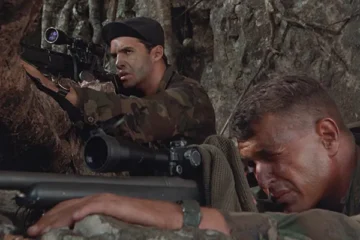 Sniper 1993 Movie Scene Tom Berenger as Thomas Beckett looking through the scope of his M40 sniper rifle and Billy Zane as Richard Miller doing the same