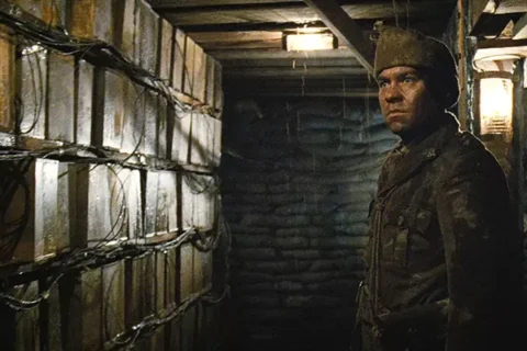 Beneath Hill 60 2010 Movie Scene Brendan Cowell as Oliver Woodward looking at the explosives in the tunnel