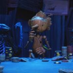 Guillermo del Toros Pinocchio 2022 Movie Scene Pinocchio playing poker with black rabbits in the underworld