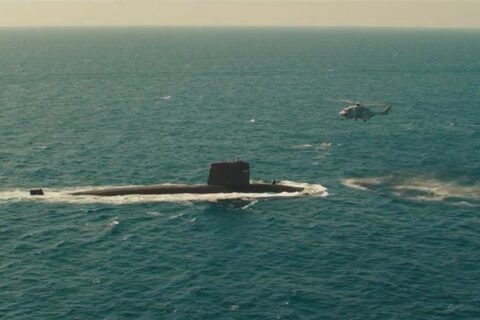 The Wolfs Call 2019 Movie Scene The submarine surfacing with the helicopter hovering over it