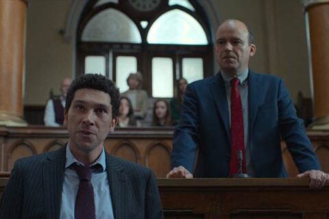 Bank Of Dave 2023 Movie Scene Joel Fry as Hugh and Rory Kinnear as Dave arguing in court